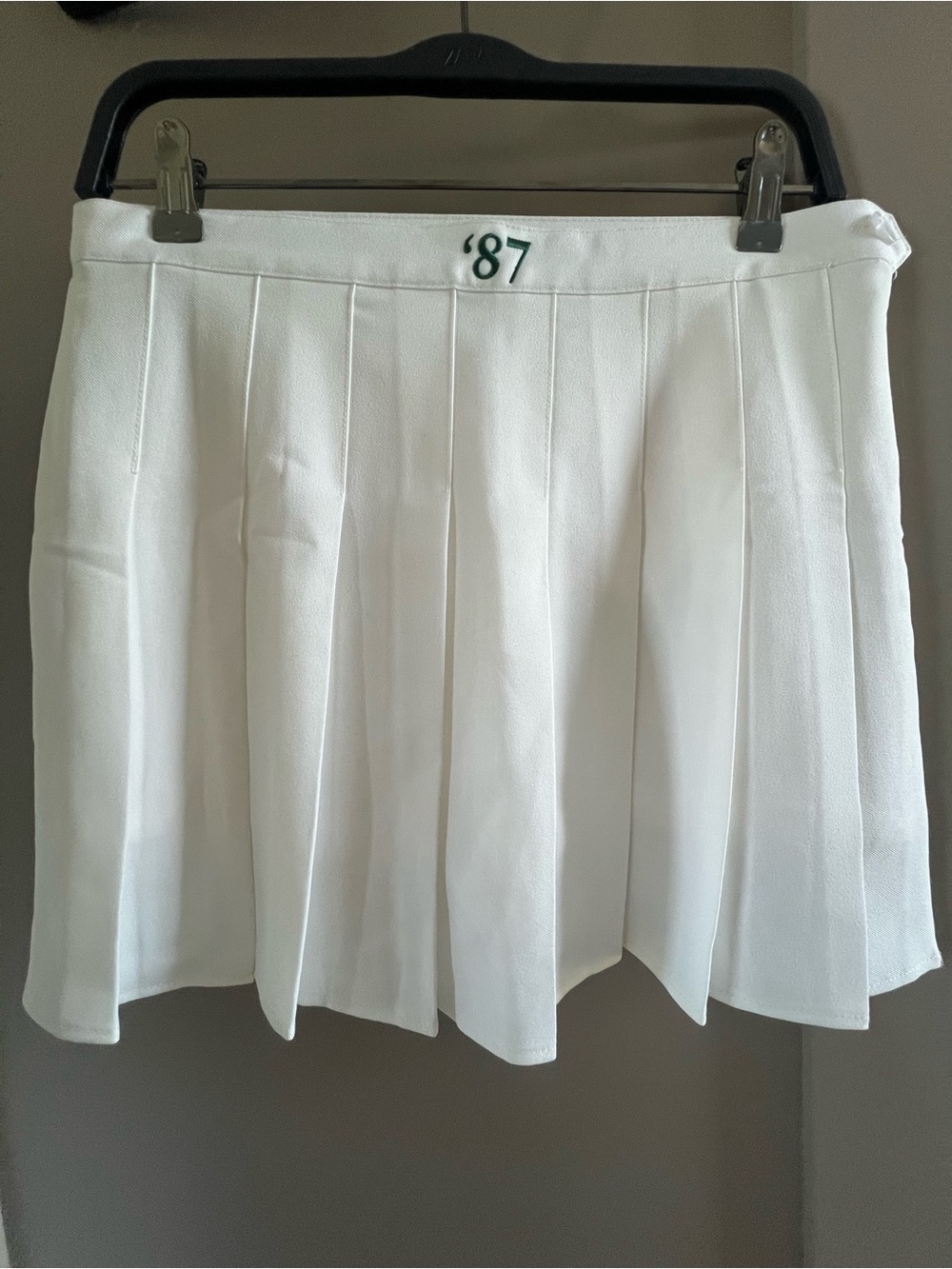 White Pleated Tennis Skirt with '87 Embroidered Detail - Picture 1 of 2